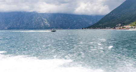 kotor bay speedboat cruise view, sea and rocky hillsの写真素材