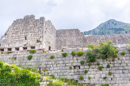 kotor fortress ruins church stones with mountain landscapeの写真素材