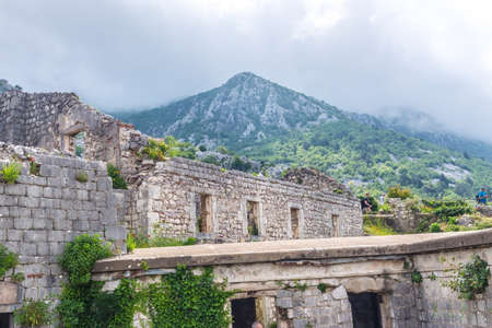 kotor fortress ruins church stones with mountain landscapeの写真素材