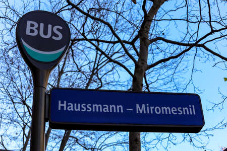 logo sign and text sign post on street in cityの写真素材