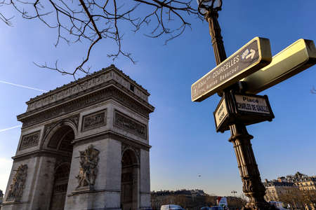 triumphal arch and street signs directionsの写真素材