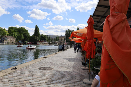 Tourists on the banks of the Ourcq canal in Parisの写真素材
