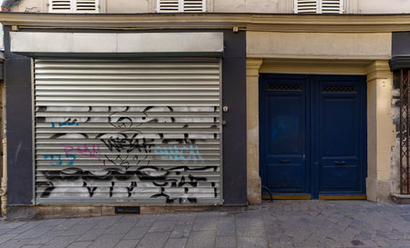 Graffiti on the wall of a shop entranceの写真素材