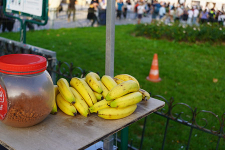 Bunch of bananas and a jar on the street.の写真素材