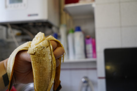 Banana in the hands of a man. Selective focus.の写真素材
