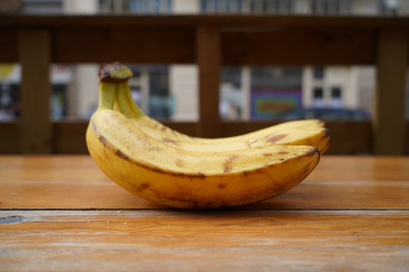 Banana on a wooden table in a cafe. Selective focus.の写真素材