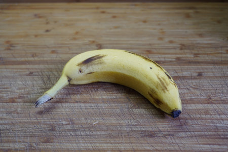 Banana on a wooden background. Close-up. Selective focus.の写真素材