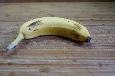 Banana on a wooden table. Close-up, selective focus.の写真素材