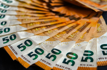 Euro banknotes on a dark background close-up macro photography.の写真素材