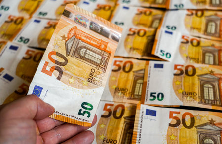 Close-up of one hundred euro banknote in the hands of a manの写真素材