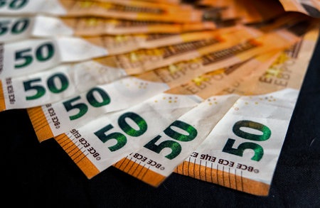 Euro banknotes on a black background close up. Selective focus.の写真素材