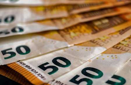 Euro banknotes on a dark background close-up macro photography.