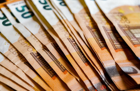 Euro banknotes of 50 and 100 euros as a background close up