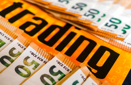 Close-up of a group of 50 Euro banknotes in orange and blackの写真素材