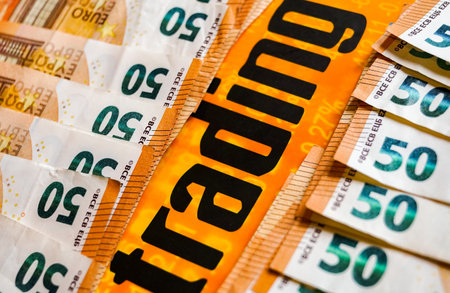 Euro banknotes stacked in a row on a white background. Close-up.の写真素材