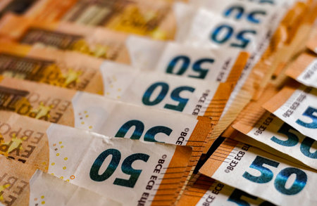Euro banknotes of different denominations close-up. Shallow depth of field