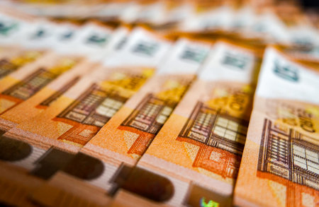 Euro banknotes in a row as a background. Shallow depth of fieldの写真素材