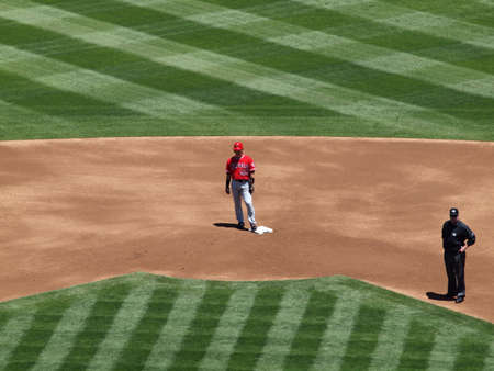 Angels Hideki Matsui stands on second base with second base umpire in frame.  June 10 2010 Oakland coliseum Californiaのeditorial素材