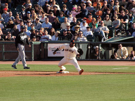 Giants Vs. Marlins: Giants Pablo Sandoval steps forward and reachs out glove to catch ball while standing on first.  July 28  2010 Att Park San Francisco Californiaのeditorial素材