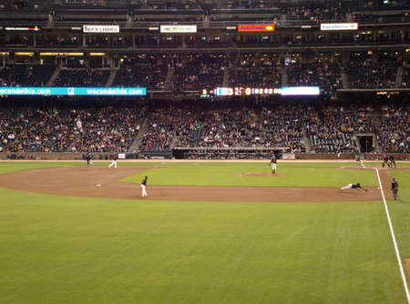 San Francisco Giants vs. Oakland A's: Third baseman Pablo Sandoval stretch in attempt to catch ball down the thirdbase line during a exhibition night baseball game, taken at At&T Park San Francisco on April 1, 2010.のeditorial素材