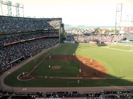 New York Mets vs. San Francisco Giants:    Mets runners running as giants go after deep fly ball to the outfield. Giants Matt Cain pitching. Taken July 17 2010 at  ATT Park San Francisco.のeditorial素材