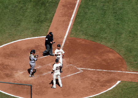 Giants vs. Pirates: San Francisco Giant Aaron Rowand celebrates a home run at homeplate taken at At&T Park San Francisco California on April 14, 2010.のeditorial素材