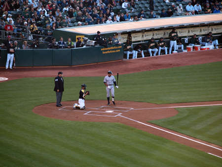 Yankees 6 vs A's 2:  Yankee Alex Rodriguez adjusts himself as he steps out of the batters box and looks in the distance, with Kurt Suzuki catching.  July 7 2010 at the Coliseum in Oakland California    のeditorial素材