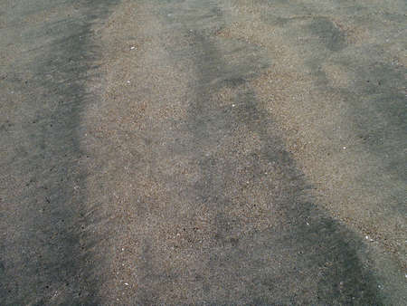 Wet Beach Sand on Ocean Beach San Francisco California. texture works well as abstract background. Sand pattern.の写真素材