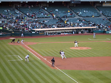 Blue Jays vs. Athletics: Blue Jays Travis Snider lays down a bunt with Jose Molina taking a lead on 1st.  Taken on August 16 2010 at Coliseum in Oakland California.のeditorial素材