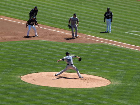 Blue Jays vs. Athletics: Blue Jays Pitcher Marc Rzepczynski in motion to throw with As Kevin Kouzmanoff taking lead at 1st.  Taken on August 18 2010 at Coliseum in Oakland California.のeditorial素材