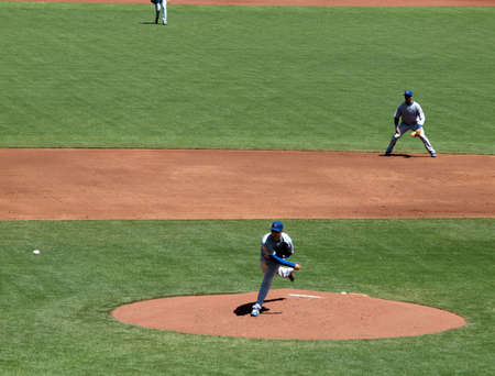Giants Vs. Cubs: Cubs Randy Wells throws pitch with shortstop Starlin Castro in view.  August 12  2010 Att Park San Francisco Californiaのeditorial素材