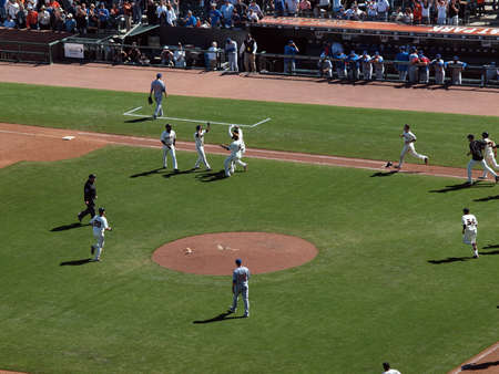 Giants Vs. Cubs: Giants Juan Uribe and Pablo Sandoval has hands to give double high fives to Andres Torres after game winning hit.  August 12  2010 Att Park San Francisco Californiaのeditorial素材