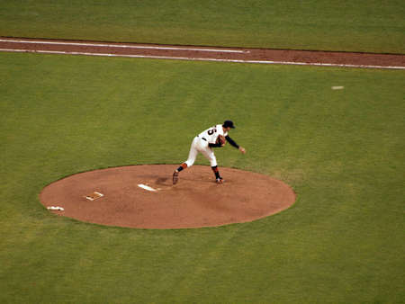 Giants Vs. Padres: Giants pitcher Barry Zito throwing a pitch with ball in mid air, during a night game.  Taken May 11 2010 at Att Park San Francisco Californiaのeditorial素材