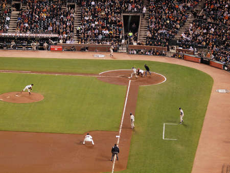 Giants Vs. Padres: Giants pitcher Barry Zito throwing a pitch with runner on third and David Eckstien batting during a night game.  Taken May 11 2010 at Att Park San Francisco Californiaのeditorial素材