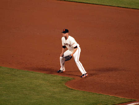 Giants Vs. Padres: Giants first baseman Aubrey Huff squats at first waiting for start of play during a night game.  Taken May 12 2010 at Att Park San Francisco Californiaのeditorial素材