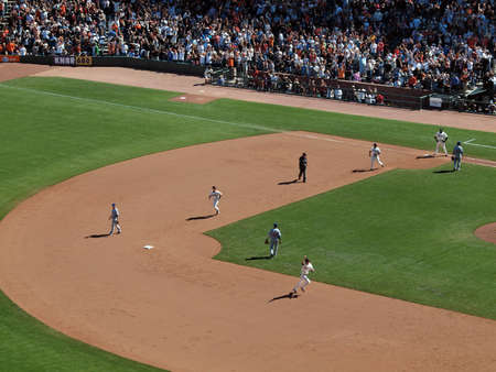 Giants Vs. Cubs: Giants Aubrey huff raises fist in the are as he rounds second base during game winning hit by Andres Torres.  August 12  2010 Att Park San Francisco Californiaのeditorial素材