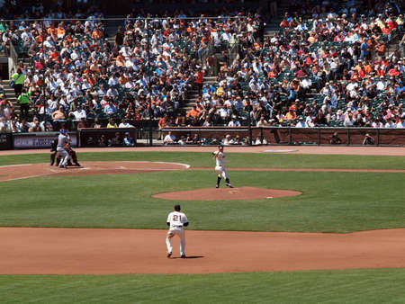 Giants Vs. Cubs:Giants Matt Cain throws pitch as 2nd baseman Freddy Sanchez standing ready and Cubs Blake DeWitt at bat.  August 12  2010 Att Park San Francisco Californiaのeditorial素材