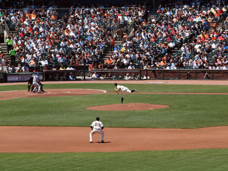 Giants Vs. Cubs:Giants Matt Cain throws pitch as 2nd baseman Freddy Sanchez standing ready and Cubs Blake DeWitt at bat as ball travels in air.  August 12  2010 Att Park San Francisco Californiaのeditorial素材