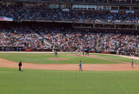 Giants Vs. Cubs: Cubs players look up as Giants Pats Burrell hit begins to travel over the fence for a homerun.  August 12  2010 Att Park San Francisco Californiaのeditorial素材