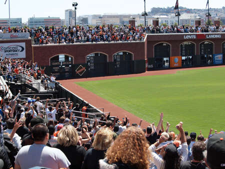 Giants Vs. Cubs: Giants Fans cheer as homerun ball hit by Juan Uribe floats over the right field arcade deck to land in McCovey Cove for a 'Splash Hit'.  August 12  2010 Att Park San Francisco Californiaのeditorial素材
