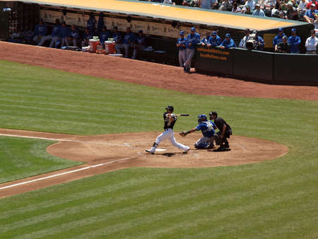 Royals vs. Athletics: As Kurt Suzuki swigs for contact during at bat.  Taken on August 4 2010 at Coliseum in Oakland California.のeditorial素材