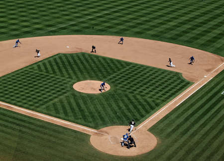 Royals vs. Athletics: Chad Pennington breaks for third and Coco Crisp for second as Daric Barton lays down a bunt.  Taken on August 4 2010 at Coliseum in Oakland California.のeditorial素材