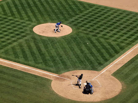 Royals vs. Athletics: Athletics Daric Barton pops up a pitch from Royals Sean O'Sullivan with catcher Brayan Pena and an umpire behind him.  Taken on August 4 2010 at Coliseum in Oakland California.のeditorial素材