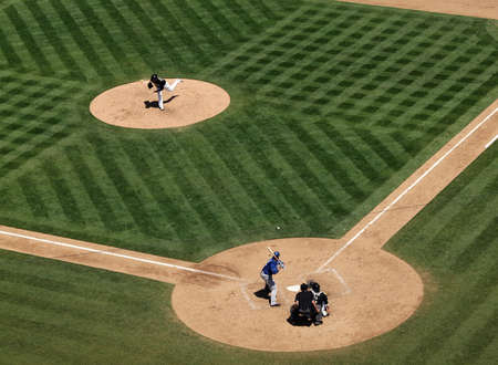 Royals vs. Athletics: Athletics Brett Anderson throws fastball to Royals Billy Butler with ball in air crossing the plate.  Taken on August 4 2010 at Coliseum in Oakland California.のeditorial素材