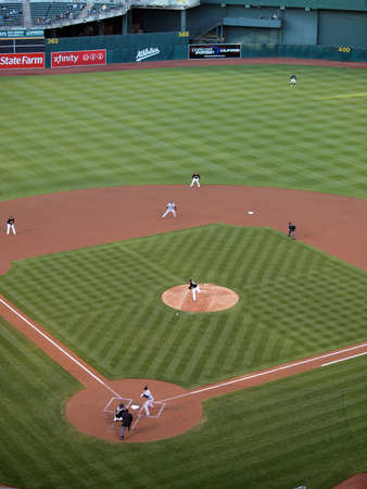 Blue Jays vs. Athletics: Athletics Brett Anderson throws pitch as ball leaves his hand with runner taking lead from 2nd.  Taken on August 16 2010 at Coliseum in Oakland California.のeditorial素材