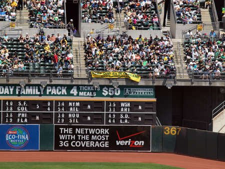 Royals vs. Athletics: Oakland Athletics fans hang sign protesting owners desire to move the team out of Oakland in the outfield bleachers.  Taken on August 4 2010 at Coliseum in Oakland California.のeditorial素材