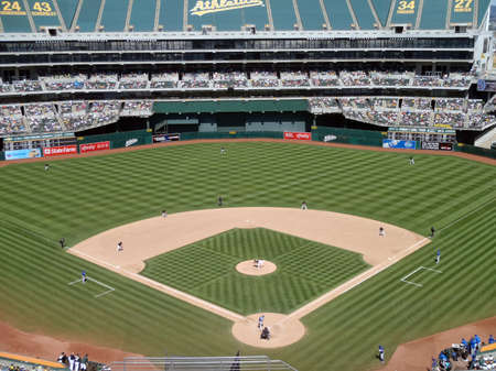 Royals vs. Athletics: Royals Yuniesky Betancourt connects with ball that would fly out for a homerun.  With the whole field in view.  Taken on August 4 2010 at Coliseum in Oakland California.のeditorial素材