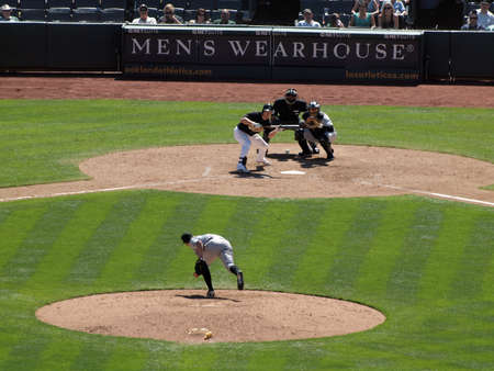 Blue Jays vs. Athletics: Athletics Cliff Pennington holds bat in bunt position to hit pitch from Blue Jays Casey Janssen.  Taken on August 18 2010 at Coliseum in Oakland California.のeditorial素材