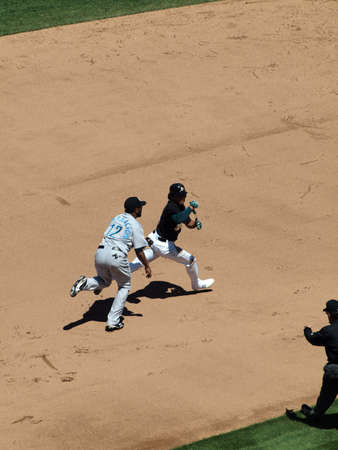 Blue Jays vs. Athletics: Athletics Coco Crisp is ran after by Blue Jays SS Yunel Escobar during a run down play.  Taken on August 18 2010 at Coliseum in Oakland California.のeditorial素材