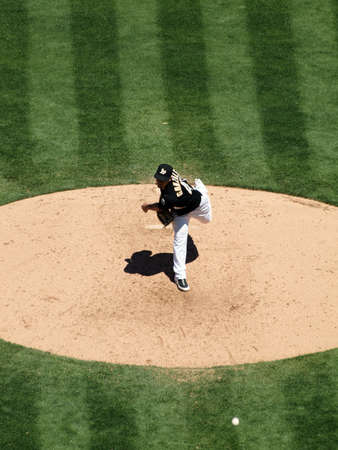 Blue Jays vs. Athletics: Athletics Gio Gonzalez steps forward as he throws a pitch.  Taken on August 18 2010 at Coliseum in Oakland California.のeditorial素材